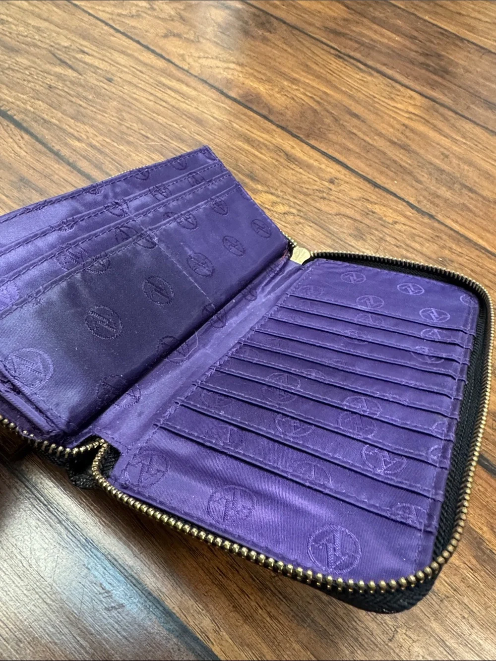 Adrienne Vittadini Black Zip Around Wallet Purple Interior Pebbled